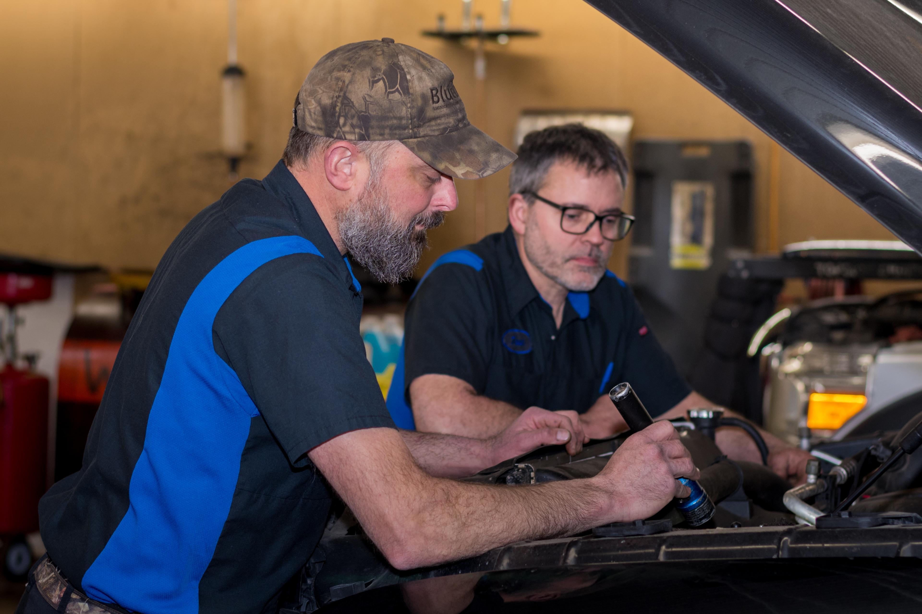 Nic and Josh working together in the shop