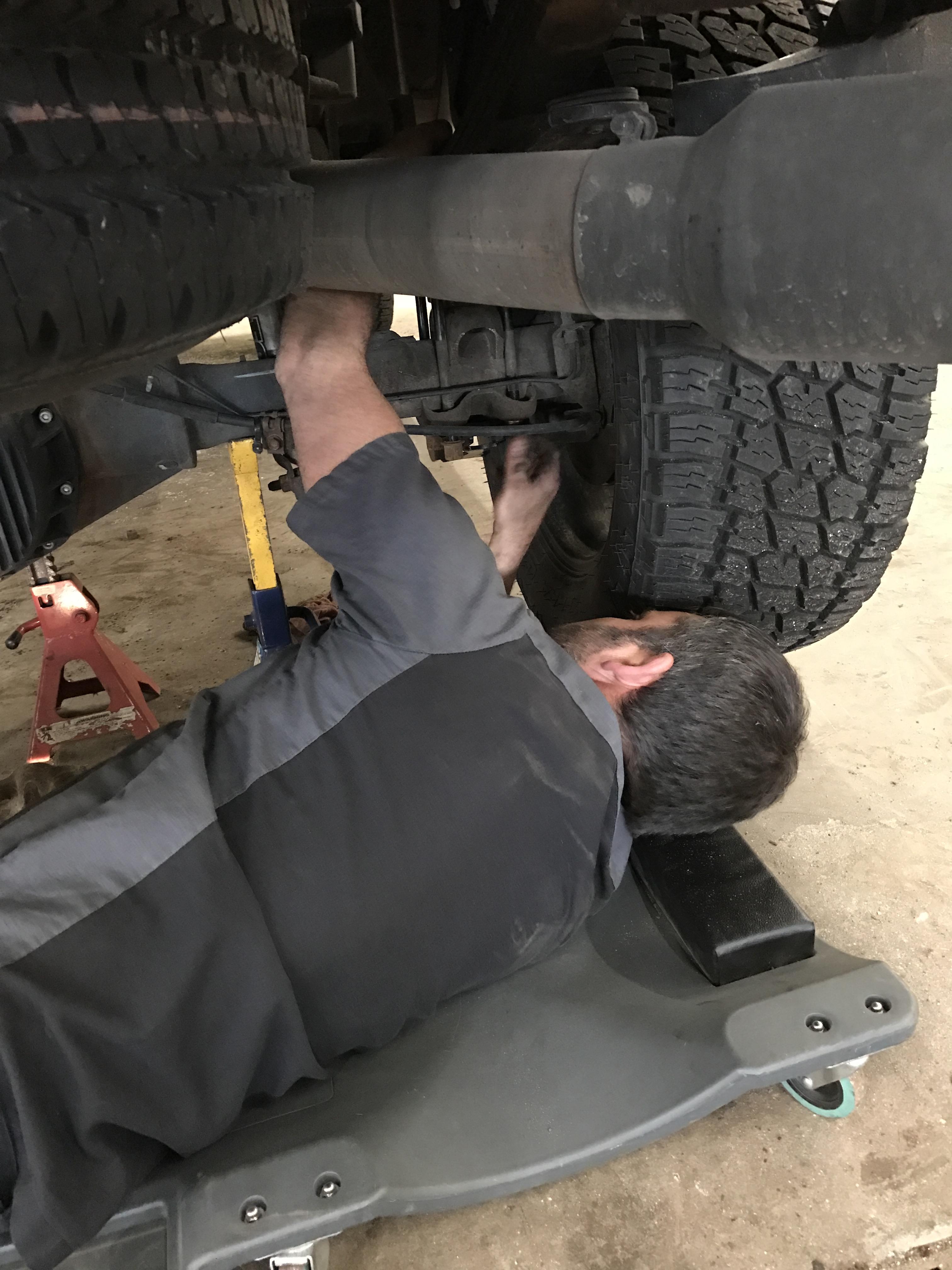 Josh working on a tire at Carr Craft Automotive